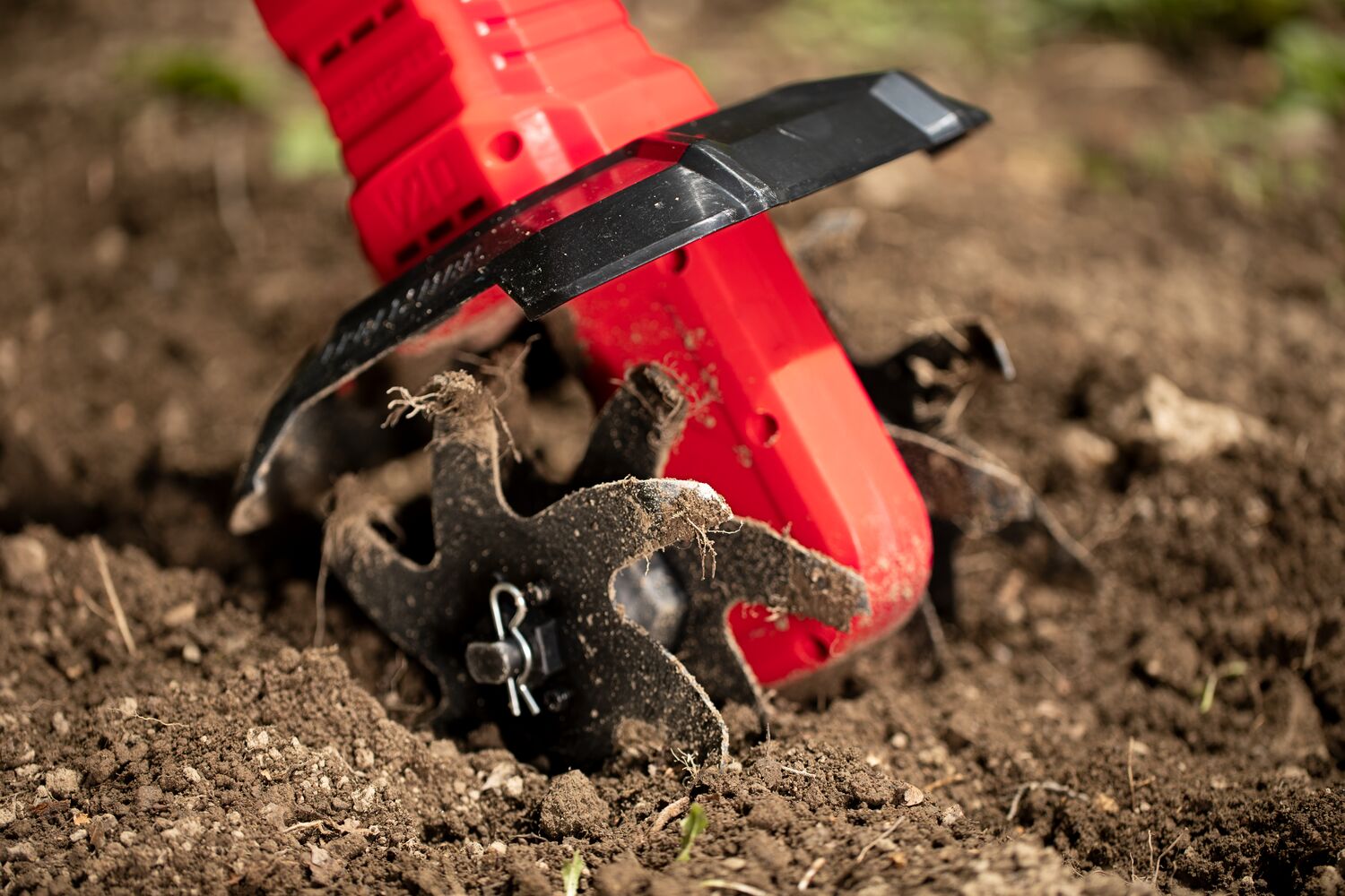 CRAFTSMAN V20 Tiller zoomed in close tines running tilling garden dirt