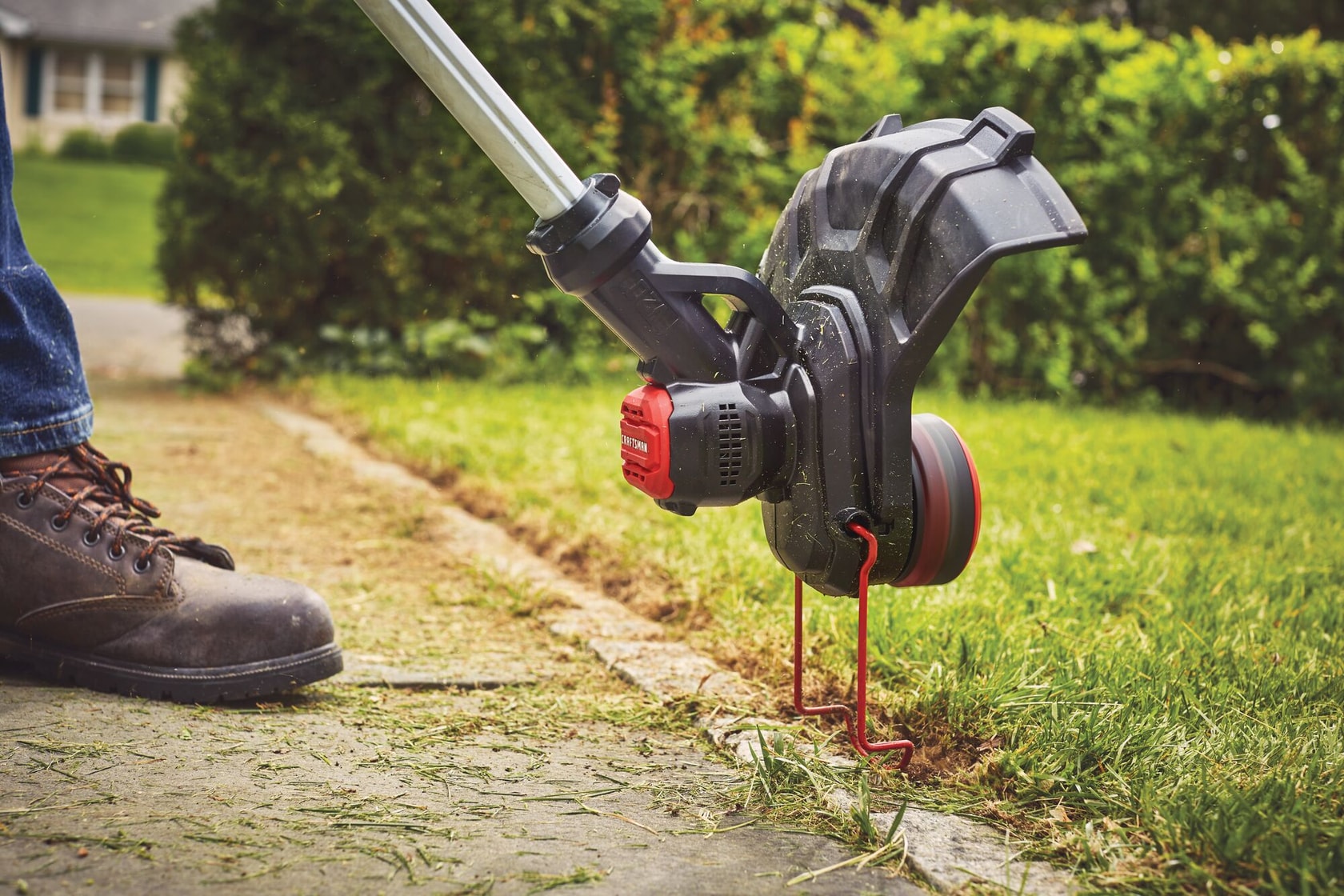 Ergonomic telescoping pole feature of 20 volt weedwacker 13 inch cordless string trimmer and edger with automatic feed kit.